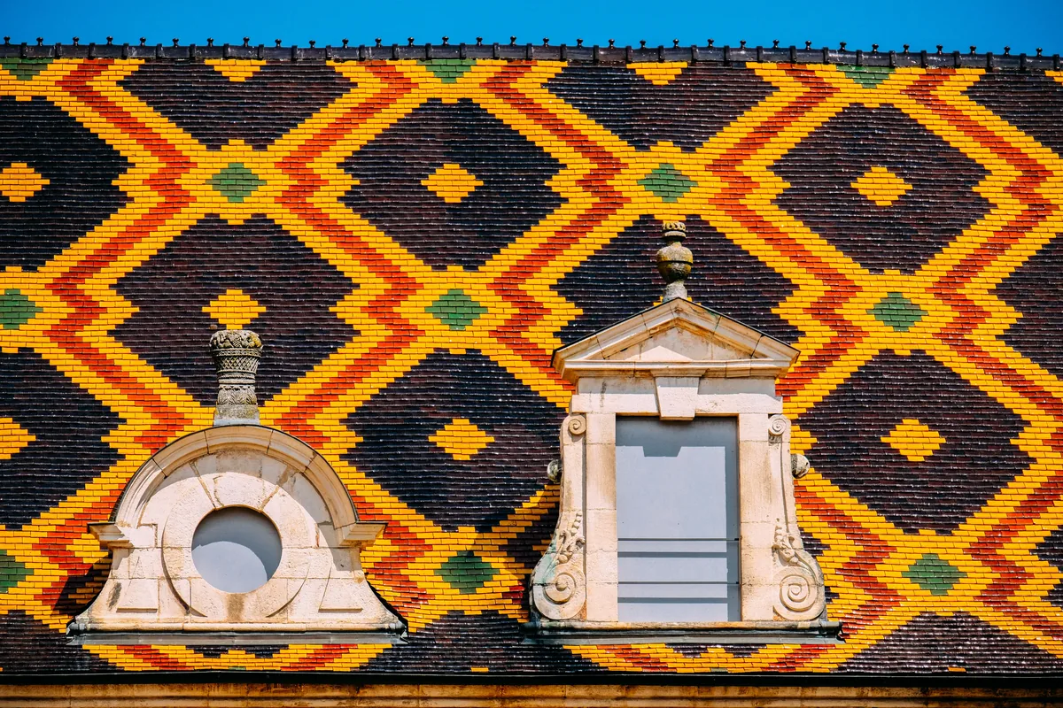 A traditional colourful glazed-tile roof in Beaune, Burgundy